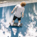 skater-with-dreadlocks-riding-skatepark